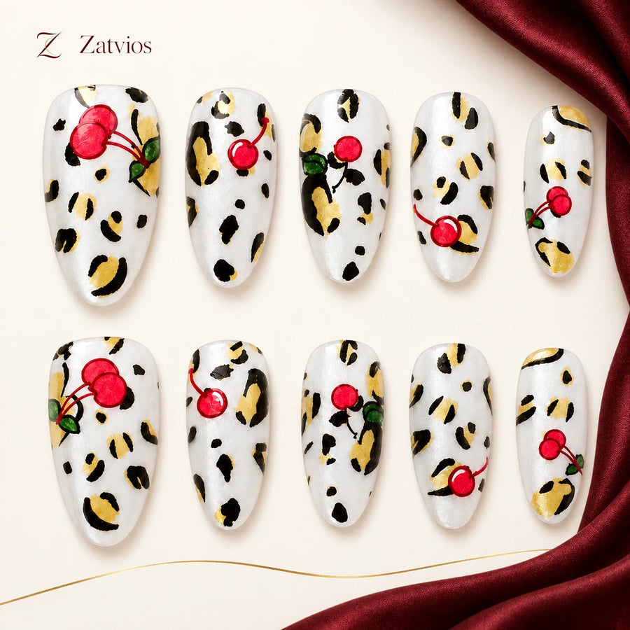 Zatvios Cherry Whisper DM-147 — ten-nail design display; Cherry red / Ivory / Black / Warm gold-toned marks