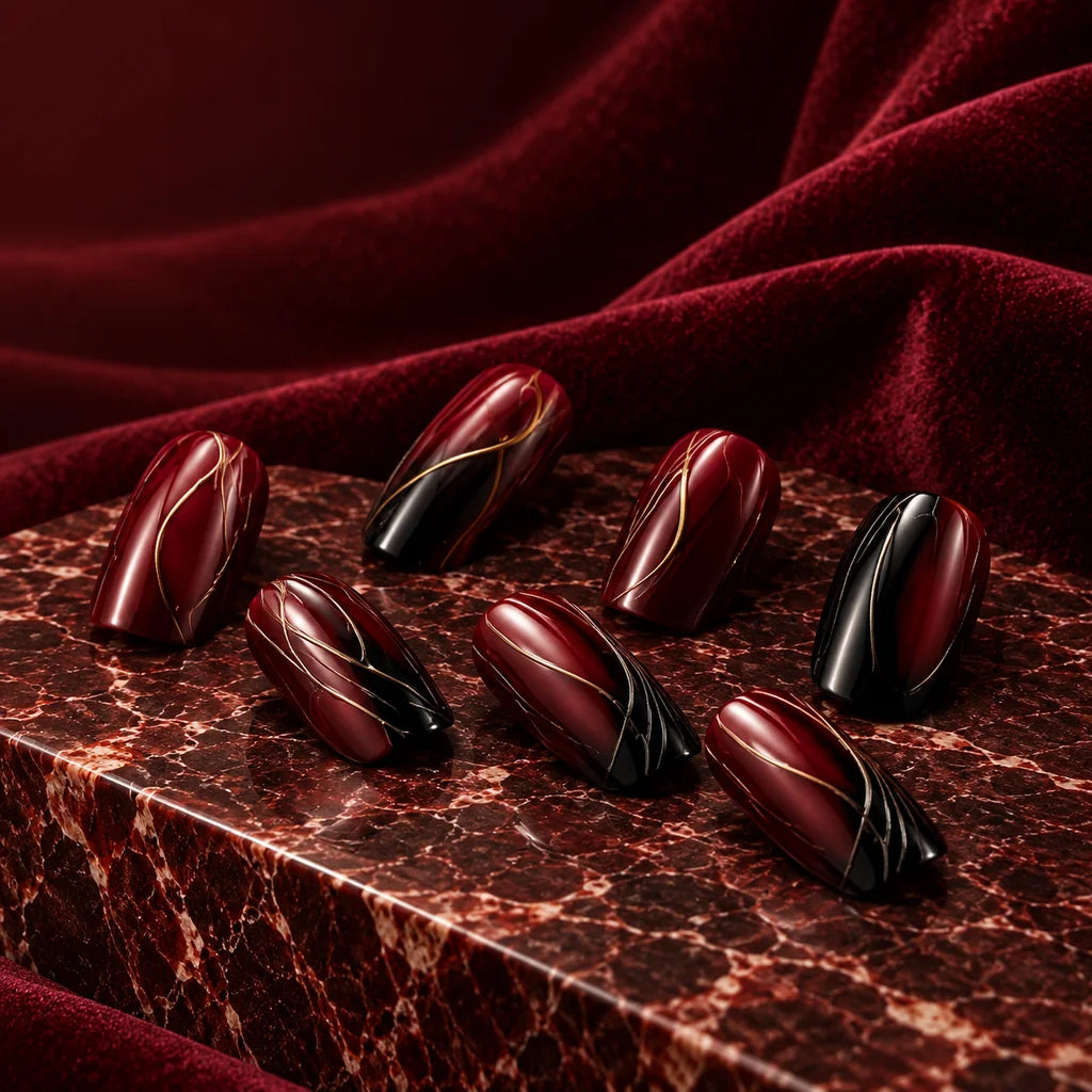 Burgundy and black nail art editorial study on velvet and marble