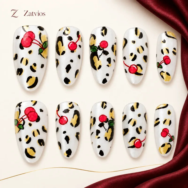 Zatvios Cherry Whisper DM-147 — ten-nail design display; Cherry red / Ivory / Black / Warm gold-toned marks